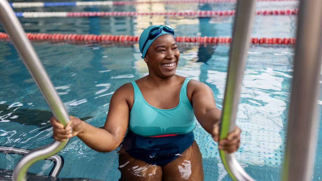 Female in swimming pool smiling