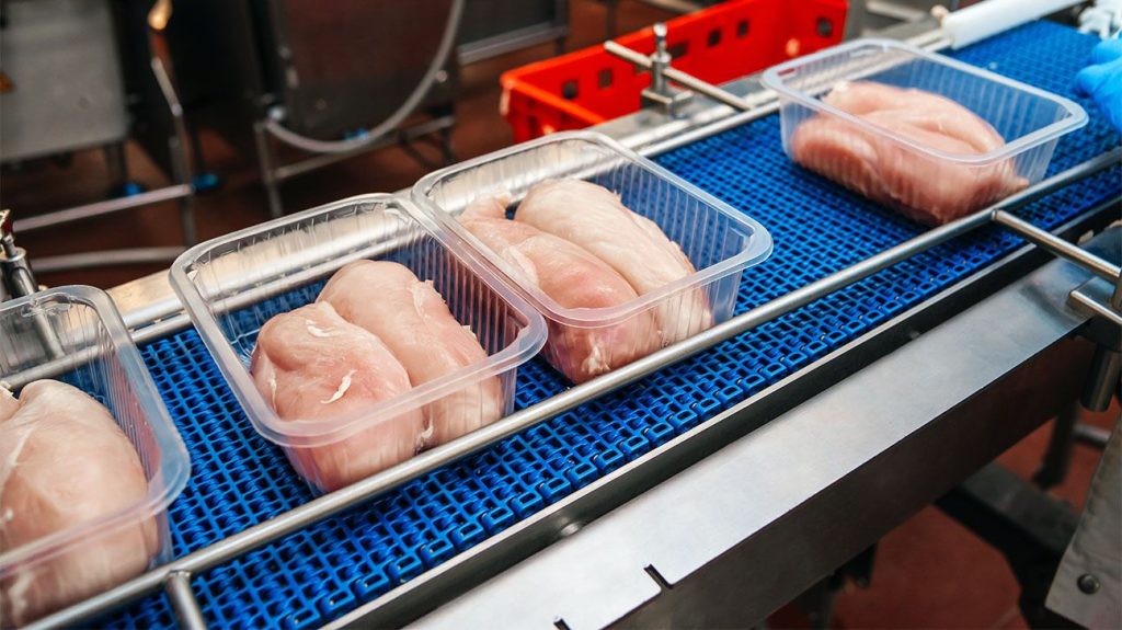 Raw chicken breasts in packaging