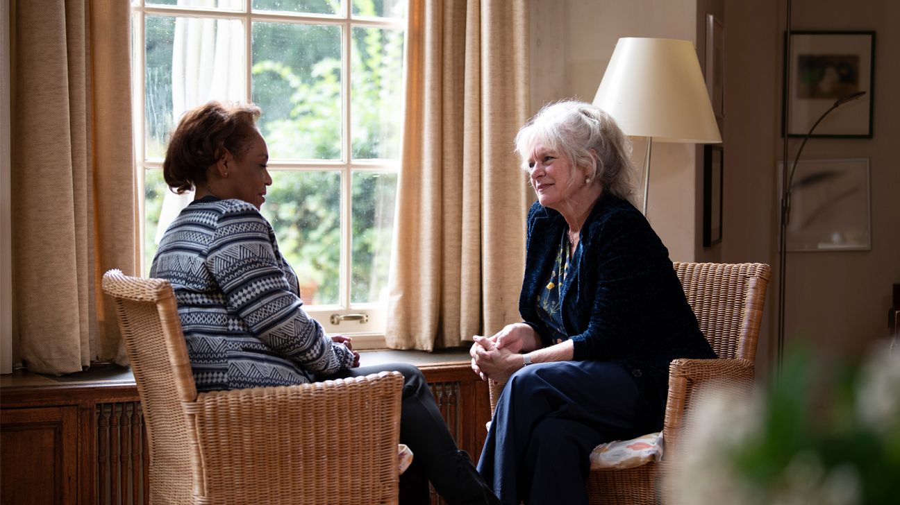 Female talking with therapist in office